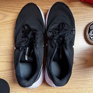 Lightly used black nike revolution sneakers.